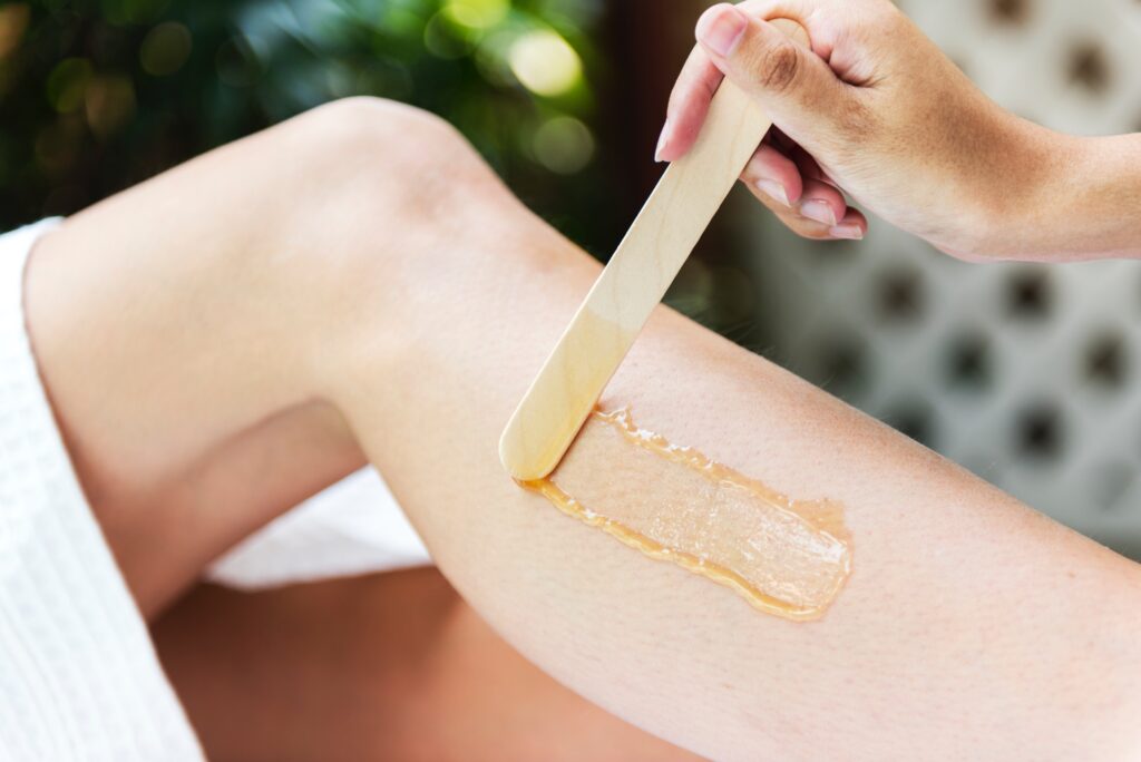 Woman applying wax